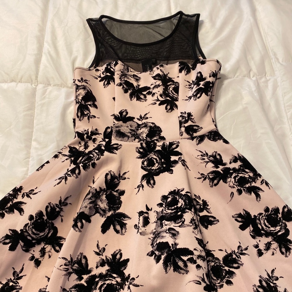 Pink fit and flare dress with floral print.